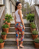 Back view of colorful crochet-print leggings on back deck steps