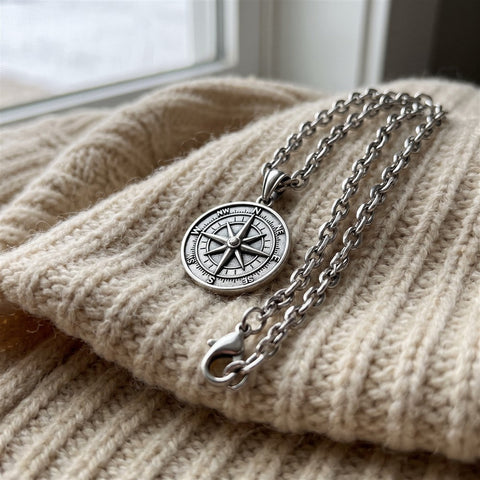 Close-up of the compass pendant and chain links
